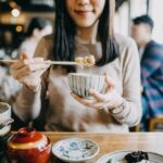 Woman eating Japanese food