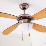 A ceiling fan hanging in a room